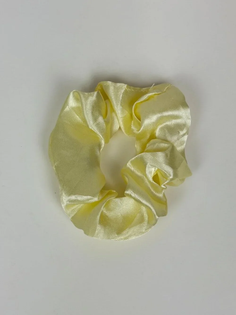 Pale yellow satin scrunchie. New without tags. Never used. Unbranded